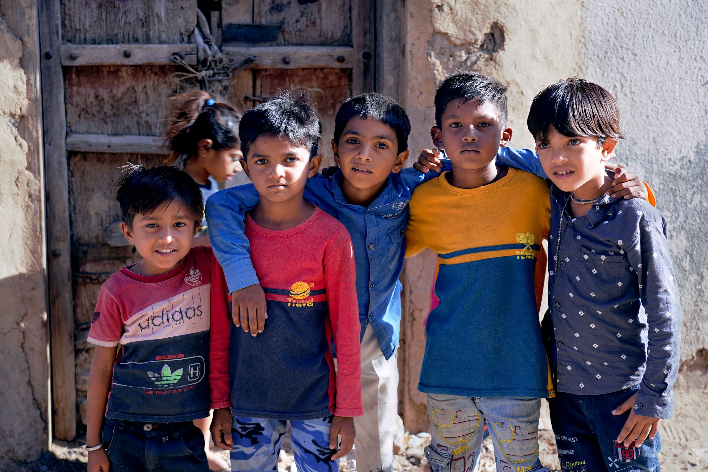 Children smiling together in an overseas village community
